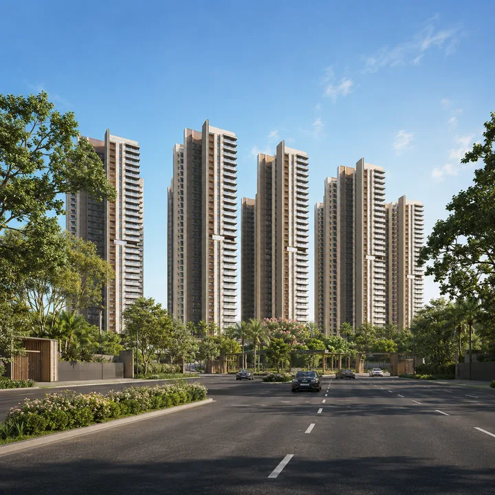 SNN Sarjapur Road arrival along the 30 m approach road, with the gated entry and the towers set back behind planted verges SNN Sarjapur Road arrival along the 30 m approach road, with the gated entry and the towers set back behind planted verges